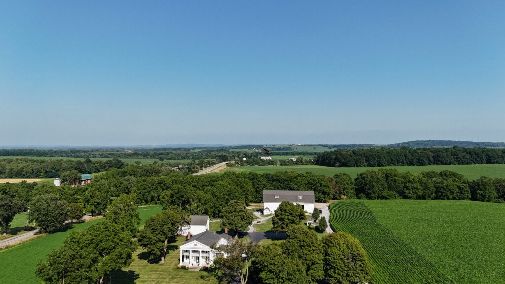 Drone photo of The Wells Estate wedding venue and surrounding land in Avon, New York
