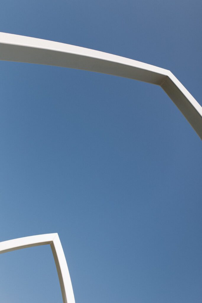 The Wells Estate grand ceremony arches in Avon, New York, surrounded by open fields and natural light